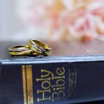 bible verses about marriage two wedding bands resting on top of the holy bible