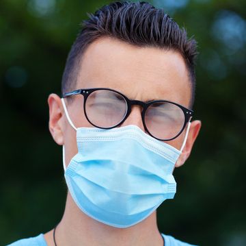 young man wearing a protective face mask and eyeglasses